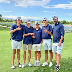 The AAHS Boys Golf team poses for a picture on the golf course.